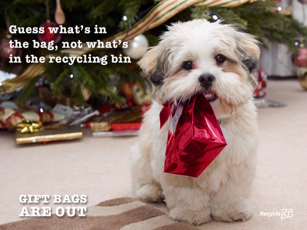 Puppy Dog with Gift Bag in Mouth. Message - Bags are out of recycling bin.
